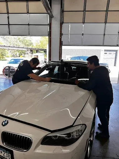 Savon technicians installing glass at the shop